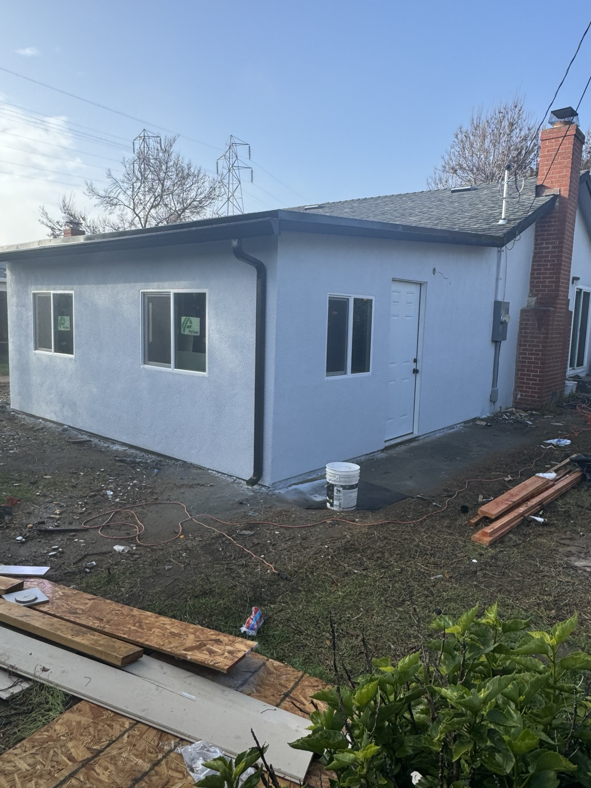 Finished white stucco ADU exterior completed by Sal Ochoa Construction Inc.