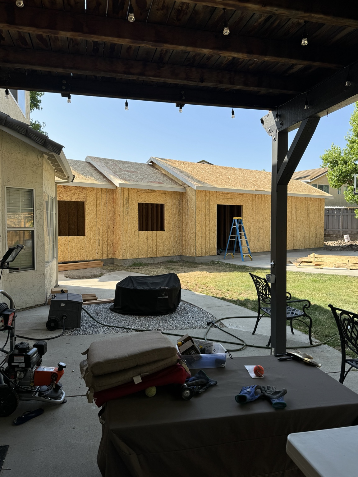 Room addition framing and exterior structure under construction.