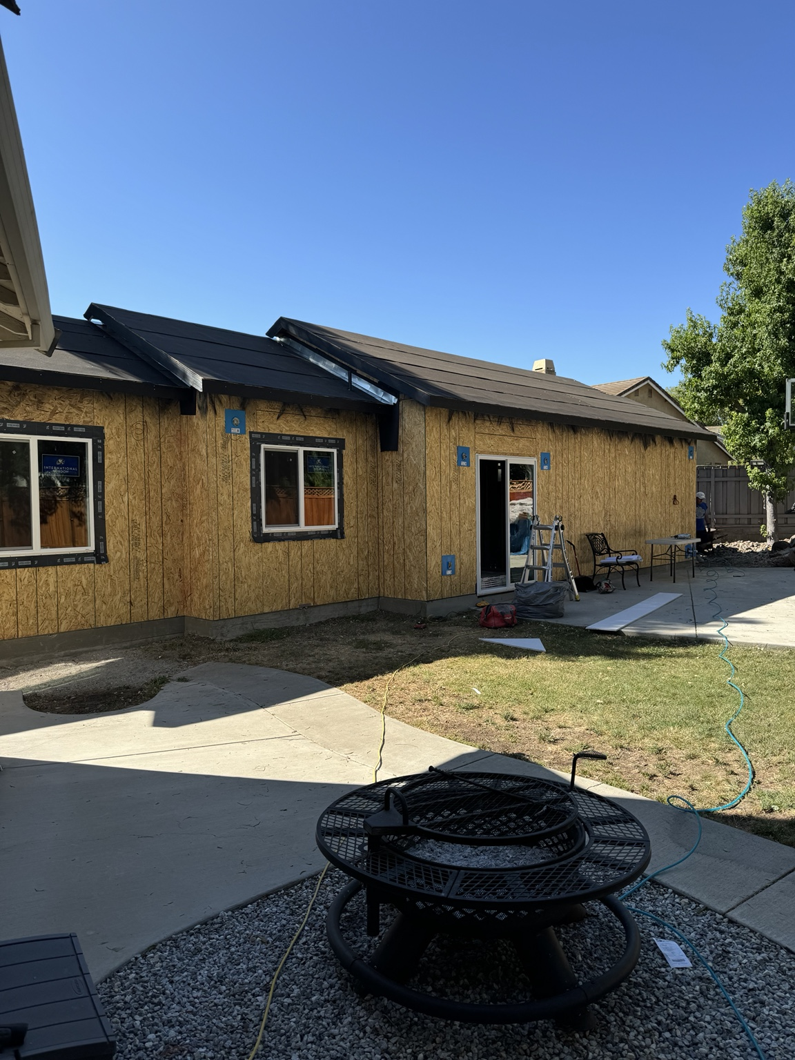 New residential structure during roofing and weatherproofing stage.