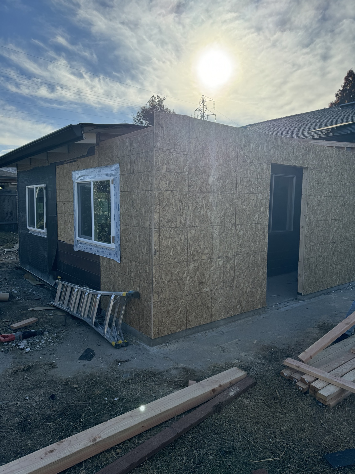Framing and sheathing installed on ADU exterior construction project.